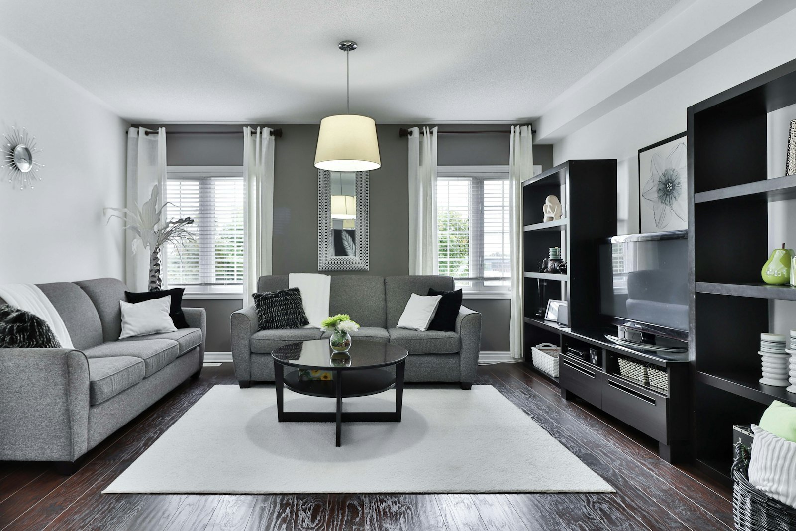Sheer curtains and blinds in a grey living room