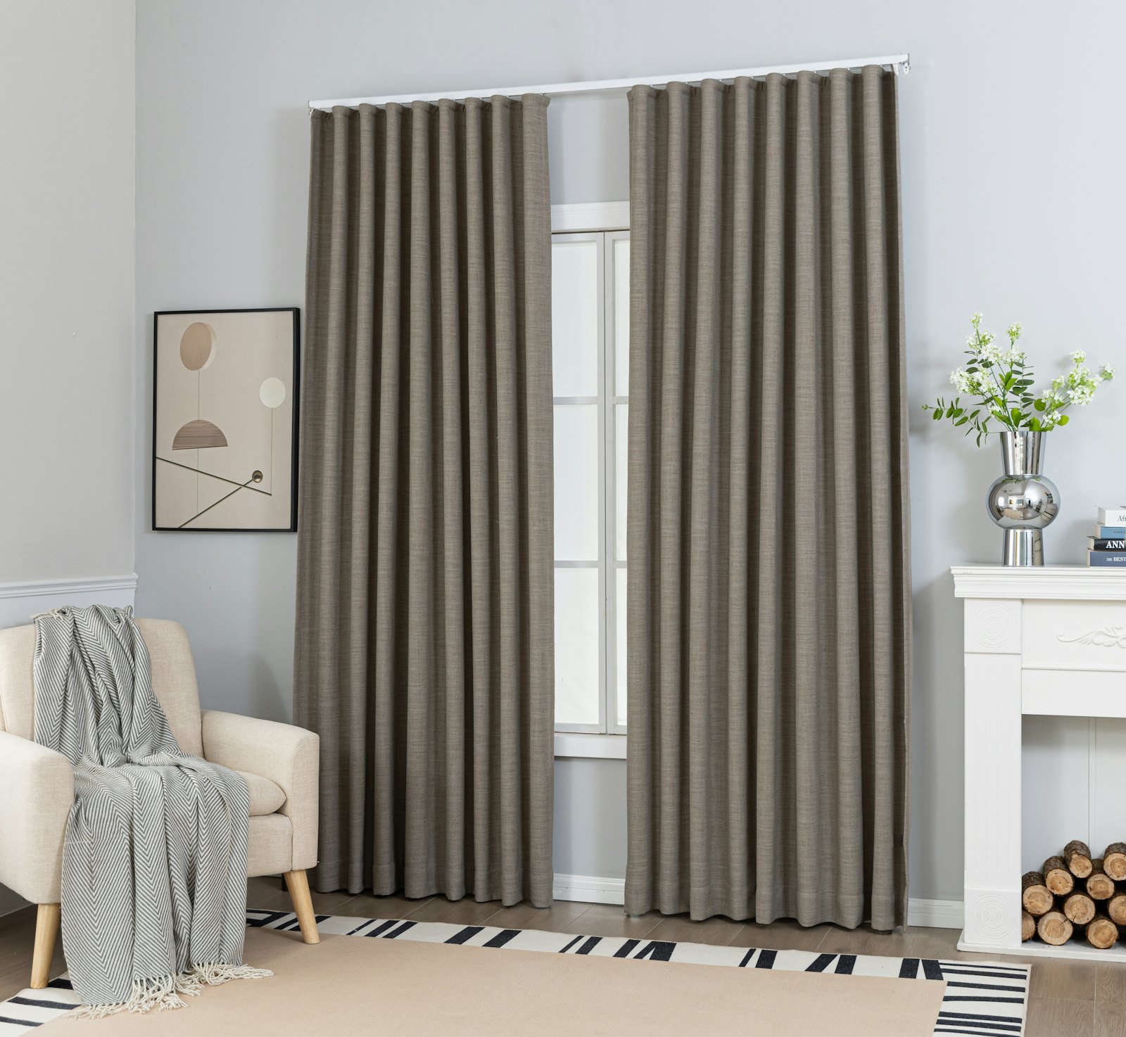 Floor-length taupe curtains framing a bright window