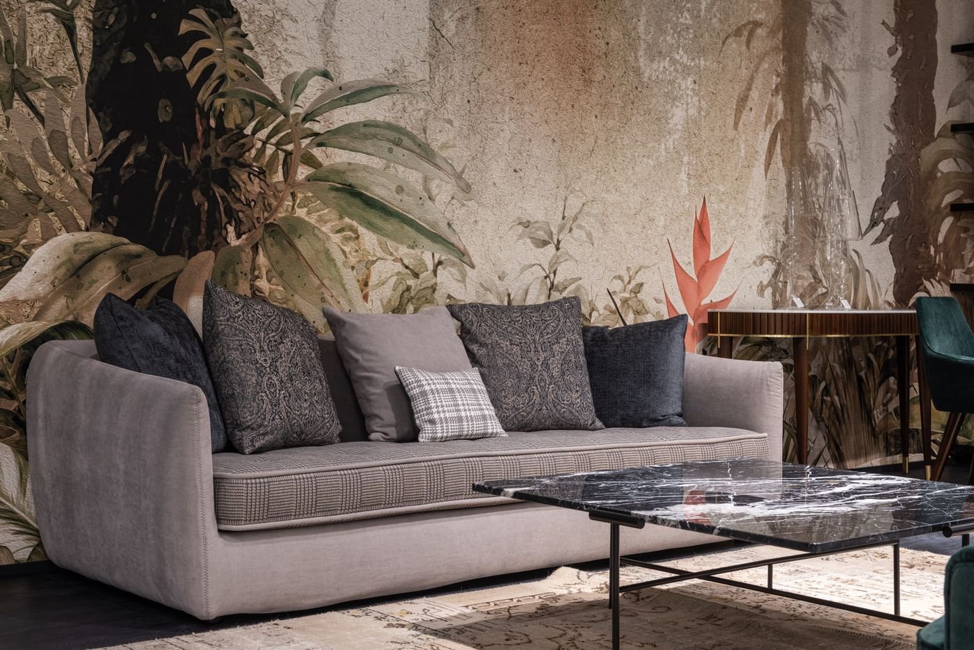 A formal living room organised around a marble feature wall