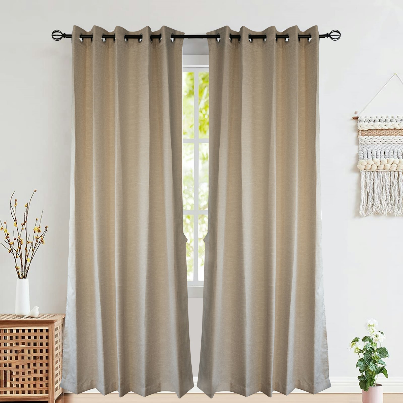 Beige curtains on a black rod, parted at a bright window